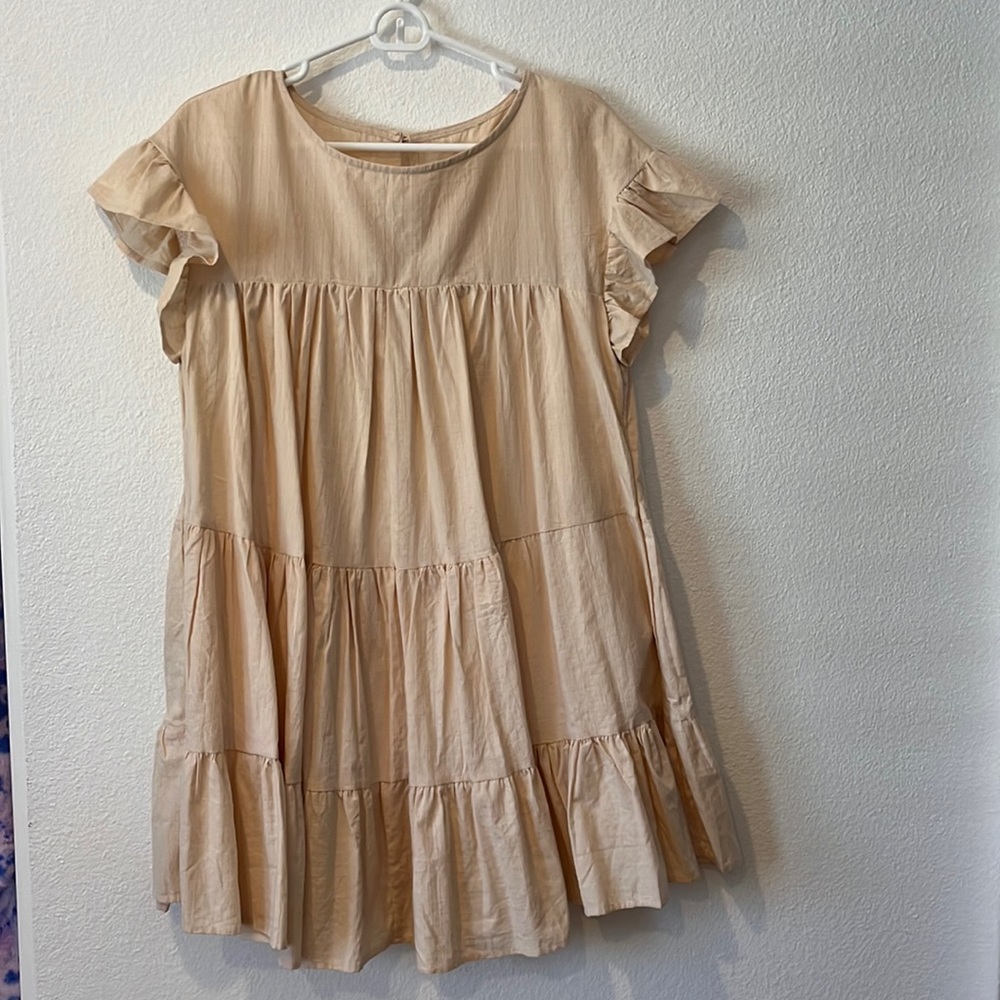 Tan women’s baby doll dress with ruffle sleeves